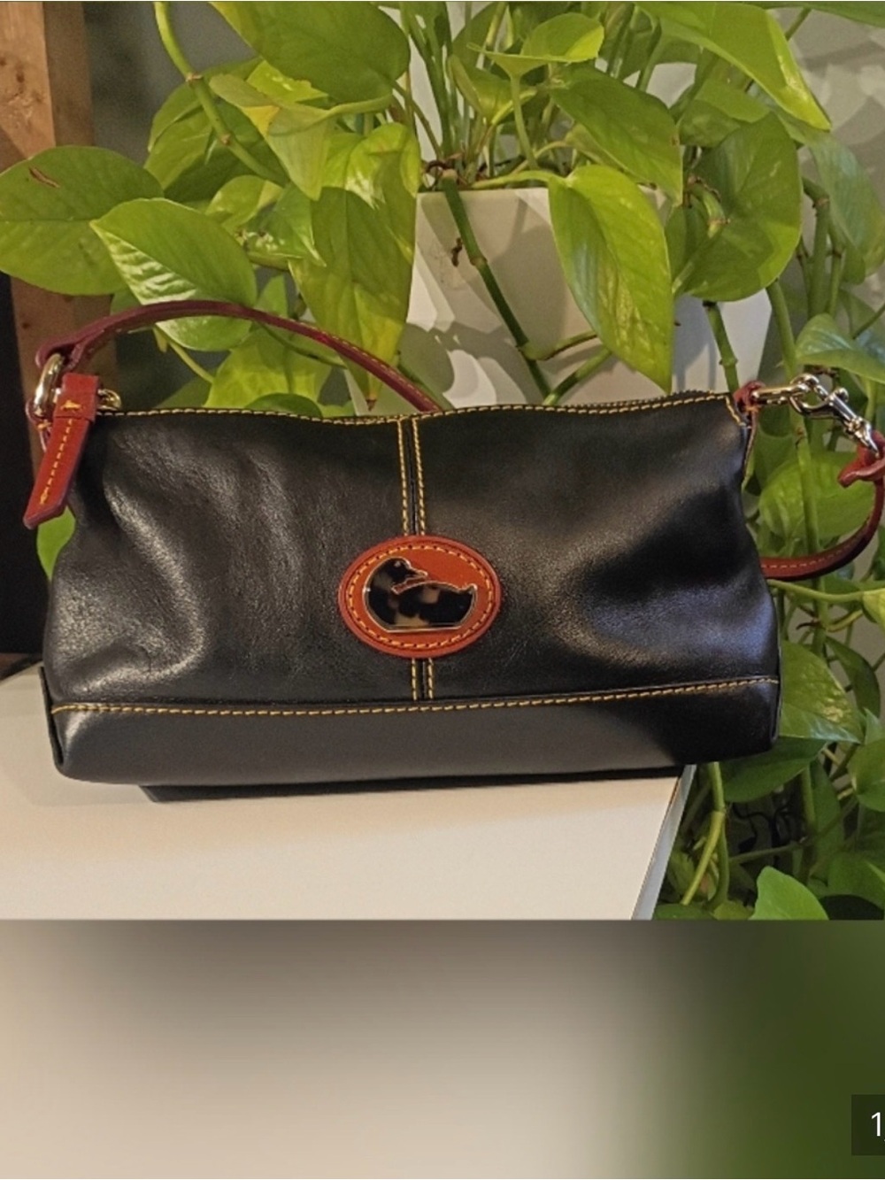 Dooney & Bourke vintage Camp Pouchette featuring black leather